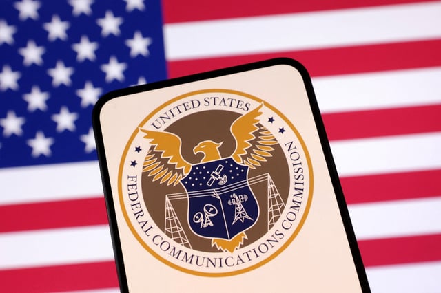 United States Federal Communications Commission logo and U.S. flag are seen in this illustration taken April 23, 2025. REUTERS/Dado Ruvic/Illustration/File Photo