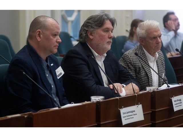  Chris Lanteigne, director of customer care with Nova Scotia Power, Nova Scotia Power CEO Peter Gregg and Chris Heck, chief digital officer with Emera, listen to questions from MLAs about the recent cybersecurity breach during an emergency committee meeting at Province House on Wednesday.