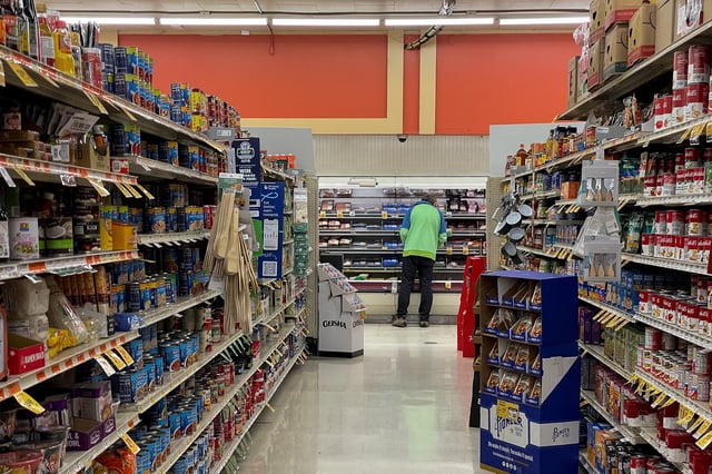 A person shops in an Albertsons supermarket in Seattle, Washington, U.S. December 10, 2024.  REUTERS/David Ryder/File Photo