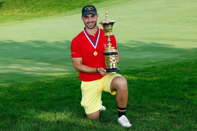 Jose Luis Ballester of Spain poses with the trophy after the 36-Hole Championship Match of the U.S. Amateur Championship at Hazeltine National Golf Club on August 18, 2024 in Chaska, Minnesota.