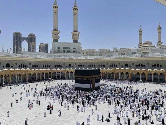 Muslim pilgrims walk around the Kaaba, the cubic building at the Grand Mosque, during the annual Hajj pilgrimage, in the Muslim holy city of Mecca, Saudi Arabia, Wednesday, June 4, 2025. (AP Photo/Amr Nabil)