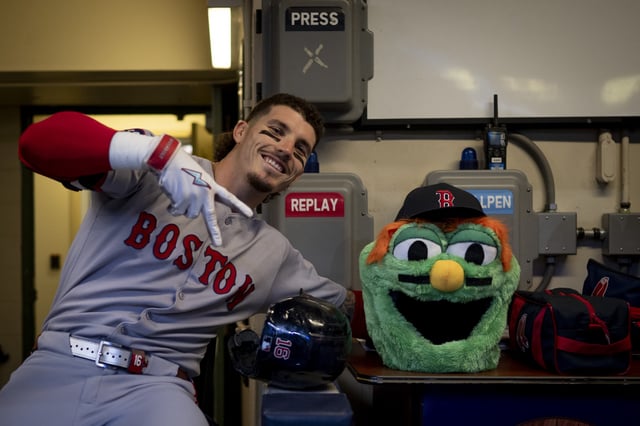 MILWAUKEE, WISCONSIN - MAY 28: Jarren Duran #16 of the Boston Red Sox poses for a photo with the Wally Home Run Head in the dugout before a game against the Milwaukee Brewers at American Family Field in Milwaukee, Wisconsin on May 28, 2025.