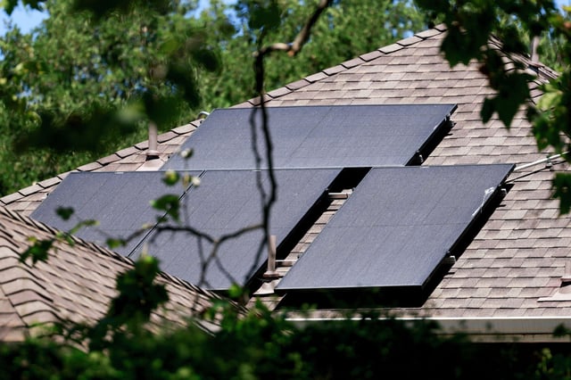 Solar panels are seen on the roof of a home in San Anselmo, Calif., on Aug. 15.