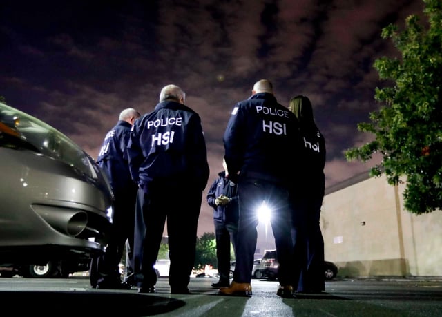 U.S. Immigration and Customs Enforcement agents gather before serving a employment audit notice at a 7-Eleven convenience store in Los Angeles in 2018. ICE arrested an unknown number of people in South San Jose on Wednesday, June 4. 