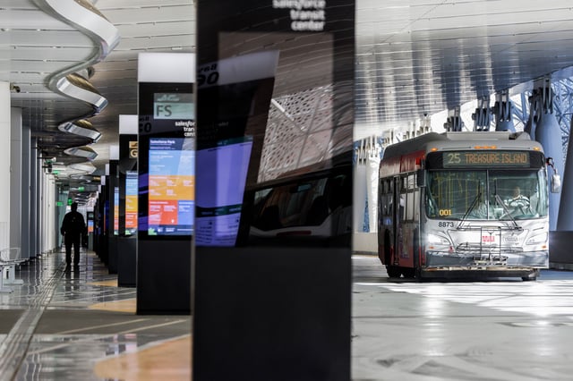 A single bus makes its way through the bus level of the Salesforce Transit Center in San Francisco, in 2023. The building complex was designed with the intent high speed rail would eventually reach its basement.