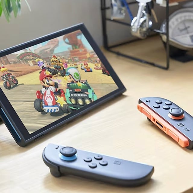 switch 2 with controllers and mario kart world on screen