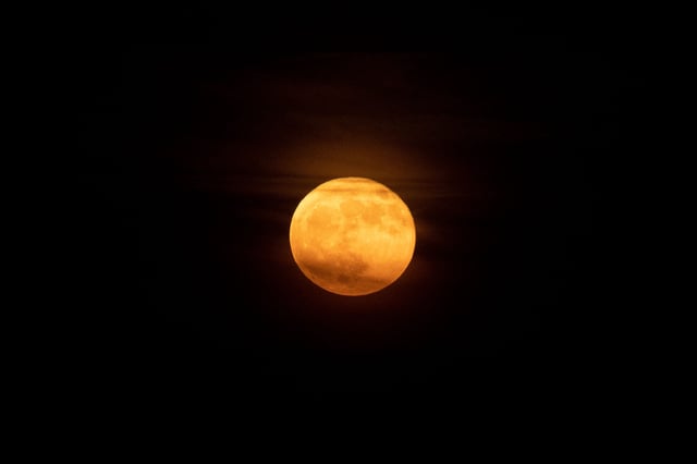 The full “Strawberry moon” is seen in Arlington, Virginia, on June 14, 2022. 
