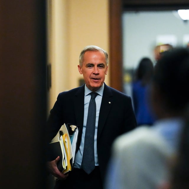Prime Minister Mark Carney heads to a cabinet meeting on Parliament Hill.