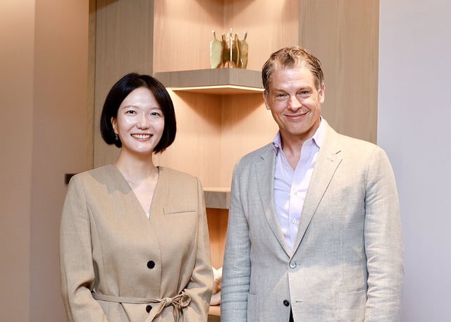 This photo, provided by Naver Corp. on June 5, 2025, shows Naver CEO Choi Soo-yeon (L) with Netflix co-CEO Greg Peters at a recent meeting in Los Angeles. (PHOTO NOT FOR SALE) (Yonhap)