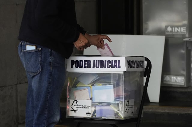 A voter casts their ballot in Mexico's first judicial elections, in Mexico City, Sunday, June 1, 2025. (AP Photo/Marco Ugarte)