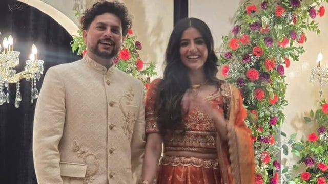 Kuldeep Yadav poses with his fiancée Vanshika at their engagement bash. 