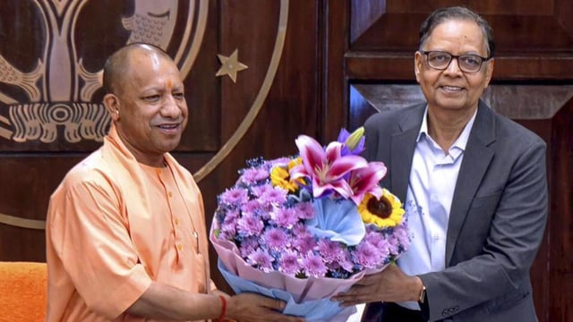 Uttar Pradesh chief minister Yogi Adityanath and 16th Finance Commission chairman Arvind Panagariya at a meeting in Lucknow on Wednesday. (PTI PHOTO)