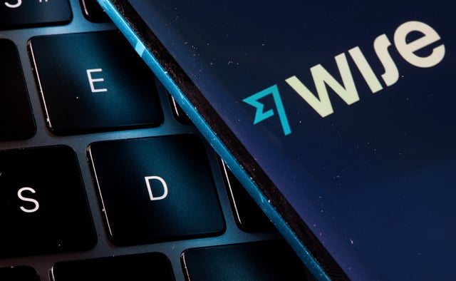 A smartphone with the Wise logo is placed on a laptop in this illustration taken on July 14, 2021. REUTERS/Dado Ruvic/Illustration