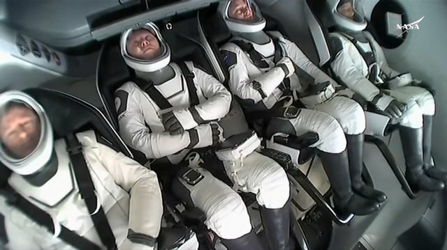 Butch Wilmore and Suni Williams and two other astronauts descend in the Crew Dragon spacecraft to their splashdown, following their return to earth from the International Space Station off the coast of Florida on March 18, 2025 in a still image from video.