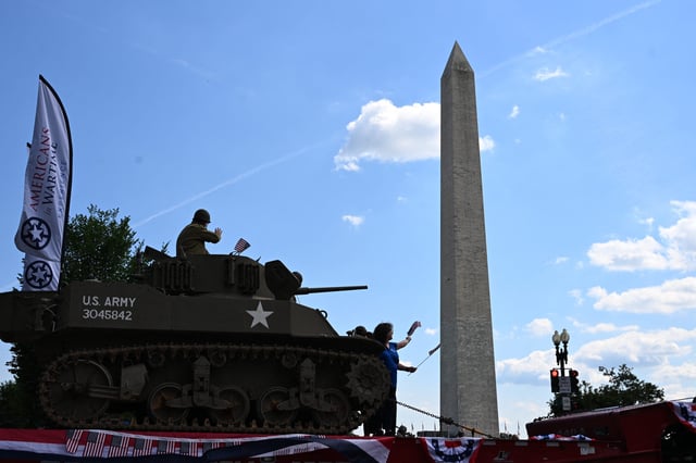 People in a US Army tank participate in the National Memorial Day Parade on Constitution Avenue in Washington, DC, May 26, 2025.
