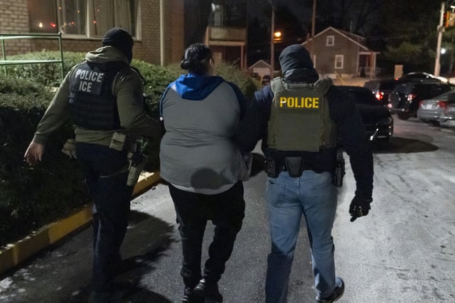 U.S. Immigration and Customs Enforcement officers detain a person, Monday, Jan. 27, 2025, in Silver Spring, Md.