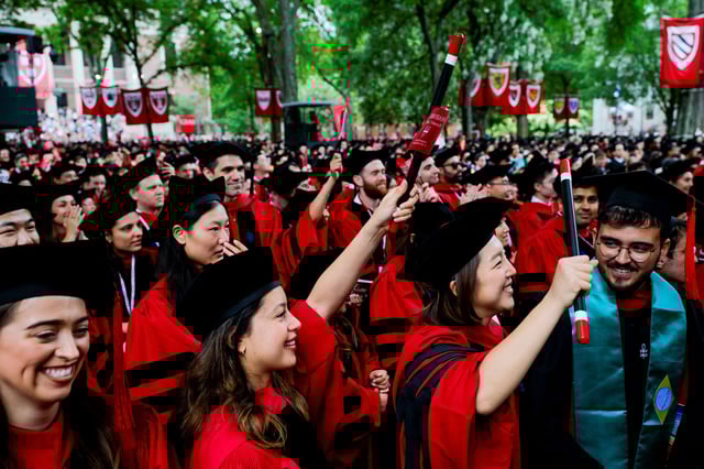 Graduating students cheer for Harvard University President Alan Garber during their commencement at Harvard University in Cambridge, Massachusetts on May 29.
