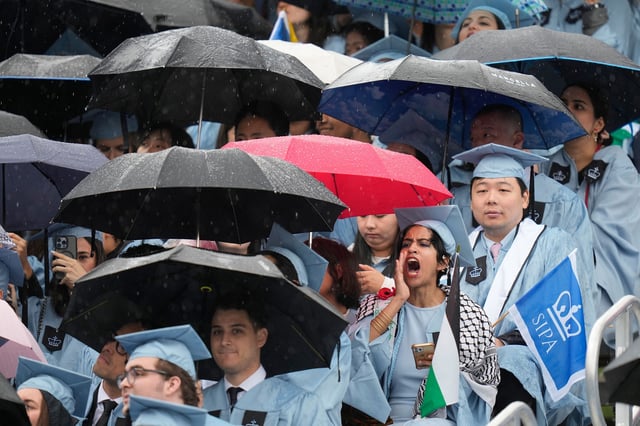 A student boo's as Columbia University's president Claire Shipman speaks during the Commencement Ceremony at Columbia University in New York on May 21.