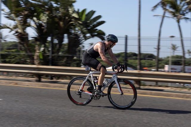 South African former Paralympic athlete Oscar Pistorius competes in a triathlon event, 12 years after murdering his girlfriend and a year after his release on parole, in the coastal city of Durban, South Africa, June 1, 2025. REUTERS/Michael Fragoeiro