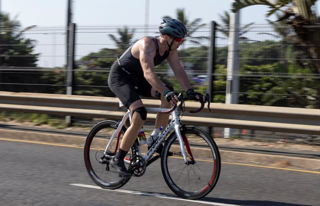 South African former Paralympic athlete Oscar Pistorius competes in a triathlon event, 12 years after murdering his girlfriend and a year after his release on parole, in the coastal city of Durban, South Africa, June 1, 2025. REUTERS/Michael Fragoeiro