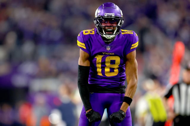 Justin Jefferson #18 of the Minnesota Vikings reacts after a play against the New England Patriots during the fourth quarter at U.S. Bank Stadium on November 24, 2022 in Minneapolis, Minnesota.