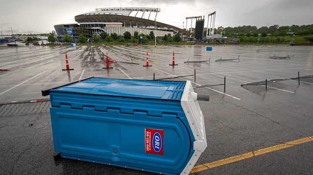 Portable toilets and portable barriers at Kauffman Stadium were toppled by a severe, tornado-warned thunderstorm that moved through Kansas City on Tuesday. The National Weather Service determined a short-lived tornado touched down nearby.