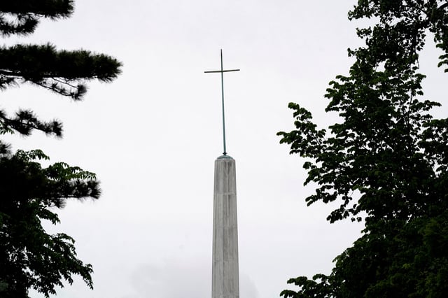 A cross sits atop the Archdiocese of Oklahoma City in Oklahoma City, Oklahoma, U.S. April 30, 2025. REUTERS/Nick Oxford/File Photo