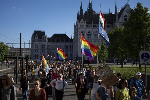 File - Hungarians march in downtown Budapest to protest against a new law banning LGBTQ+ Pride events and the populist government's restriction on assembly rights, which many critics of Prime Minister Viktor Orbán see as a crackdown on their freedom on Thursday, May 1, 2025. (AP Photo/Denes Erdos, File)