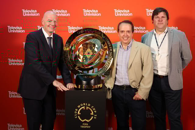 MIAMI, UNITED STATES - APRIL 17: FIFA president Gianni Infantino poses for a photo with TelevisaUnivision CEO Daniel Alegre (C) and president of global sports Olek Loewenstein (R) alongside the FIFA Club World Cup trophy prior to an interview with Despierta América at TelevisaUnivision Studios on April 17, 2025 in Miami, Florida, United States. (Photo by Eva Marie Uzcategui - FIFA/FIFA via Getty Images)