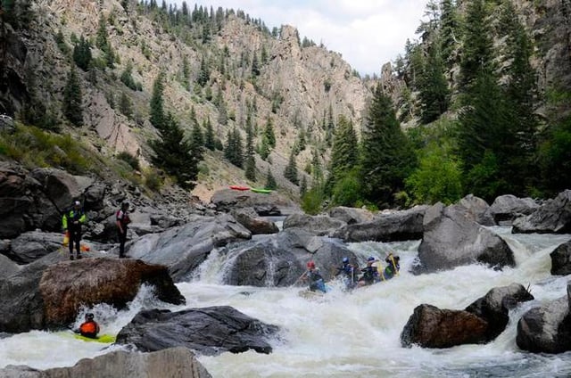 KREMMLING, CO - AUG. 24, 2014: Expert rafters and kayakers paddle through Gore Canyon&#39;s signature Gore Rapid during the annual raft and kayak race through the Class V canyon last Sunday. The Colorado River flowing through remote, steep-walled gorge just south of Kremmling is one of the state&#39;s most valuable recreational assets.(Photo By Scott Willoughby / The Denver Post)