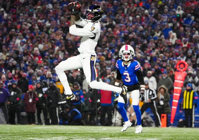 Jan 19, 2025; Orchard Park, New York, USA; Baltimore Ravens wide receiver Rashod Bateman (7) makes a catch for a touchdown during the first quarter against the Buffalo Bills in a 2025 AFC divisional round game at Highmark Stadium. Mandatory Credit: Gregory Fisher-Imagn Images/File Photo