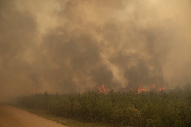A wildfire blazes near the hamlet of Weyakwin on May 31, 2025.