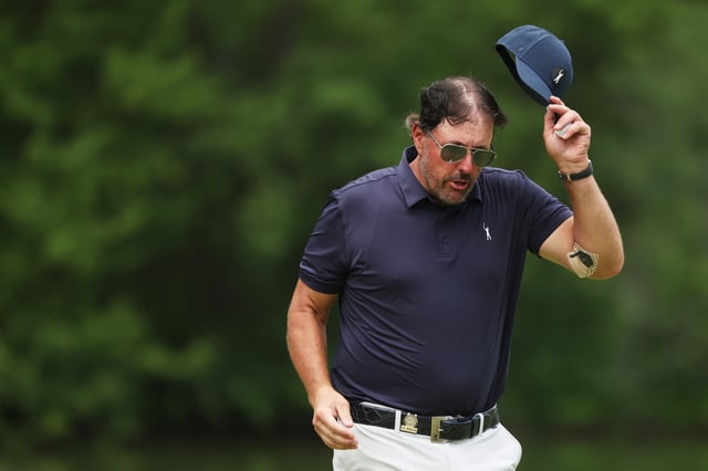 BROOKLINE, MASSACHUSETTS - JUNE 17: Phil Mickelson of the United States acknowledges the crowd from the ninth green during the second round of the 122nd U.S. Open Championship at The Country Club on June 17, 2022 in Brookline, Massachusetts. (Photo by Patrick Smith/Getty Images)