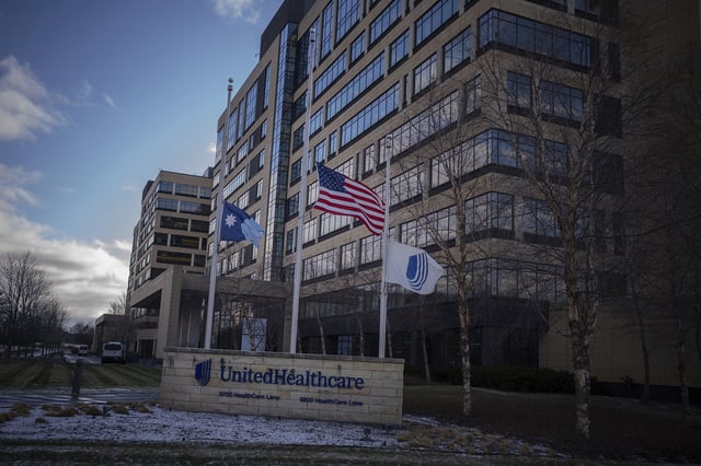 Flags fly at half mast in front of UnitedHealthcare headquarters in Minnetonka, Minn., Wednesday Dec. 4, 2024, after its CEO Brian Thompson was shot and killed in New York City.