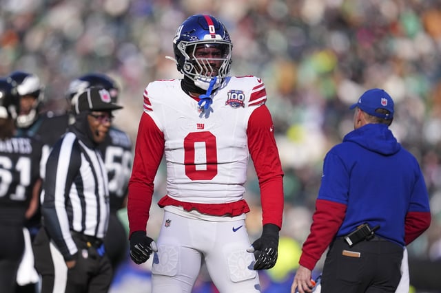 Brian Burns #0 of the New York Giants looks on against the Philadelphia Eagles at Lincoln Financial Field on January 5, 2025 in Philadelphia, Pennsylvania.