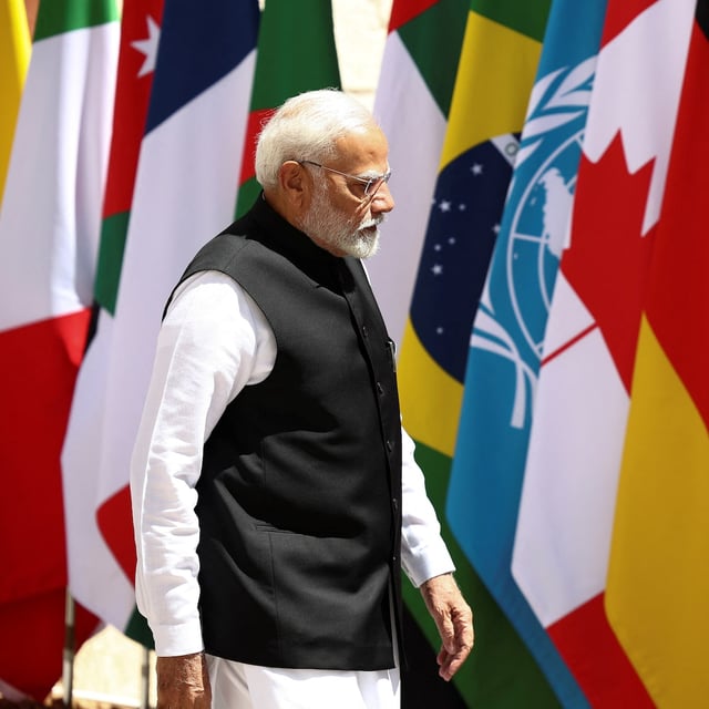India's Prime Minister Narendra Modi walks on the second day of the G7 summit, at the Borgo Egnazia resort, in Savelletri, Italy June 14, 2024. REUTERS/Guglielmo Mangiapane