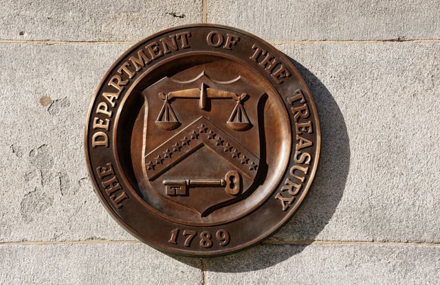 A bronze seal for the Department of the Treasury is shown at the U.S. Treasury building in Washington, U.S., January 20, 2023.  REUTERS/Kevin Lamarque/File Photo