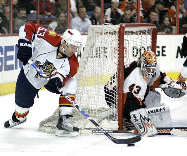  Florida Panthers center Brett McLean, left, looks to put the puck in the net as Philadelphia Flyers goalie Martin Biron, right, blocks with his stick in the first period of an NHL hockey game Tuesday, April 7, 2009, in Philadelphia.