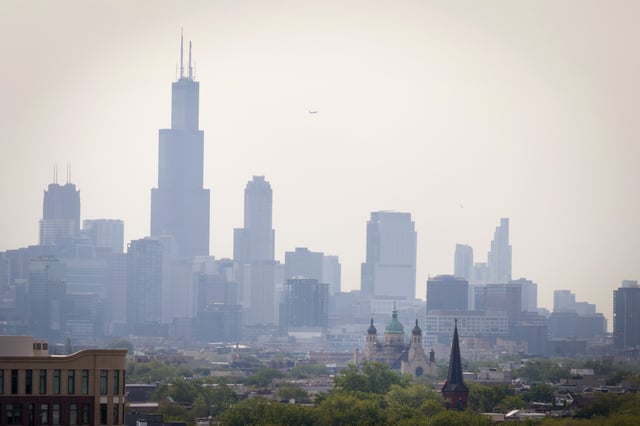 CHICAGO, ILLINOIS – JUNE 03: An aerial view shows smoke from Canadian wildfires dimming the downtown skyline on June 03, 2025 in Chicago, Illinois. The smoke is causing air quality alerts in parts of Minnesota, Iowa and Wisconsin and is visible in Illinois, Michigan, Ohio, Pennsylvania and West Virginia.  (Photo by Scott Olson/Getty Images)
