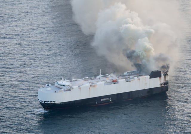 A Coast Guard C-130J Super Hercules aircrew from Air Station Kodiak conducts an overflight of a fire aboard the cargo vessel Morning Midas approximately 300 miles south of Adak, Alaska, June 3, 2025.  All 22 crew members were rescued by the crew of motor vessel Cosco Hellas with no reported injuries. (U.S. Coast Guard photo courtesy of Air Station Kodiak)