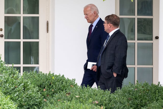 President Joe Biden speaks with White House Physician Kevin O'Connor as he arrives back at the White House in Washington, DC, on August 28, 2023, following a visit to Eliot-Hine Middle School.