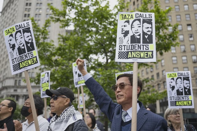 People take part in a protest outside Federal Court in Manhattan in solidarity Yunseo Chung.