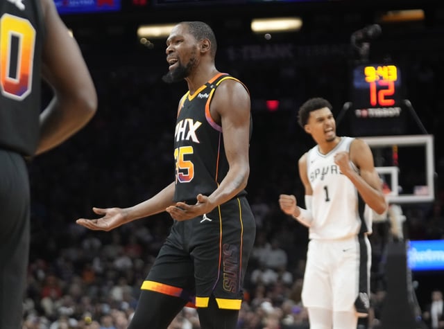 Phoenix Suns forward Kevin Durant (35) questions his team's defense against the San Antonio Spurs during NBA Cup group play at Footprint Center on Dec. 3, 2024.