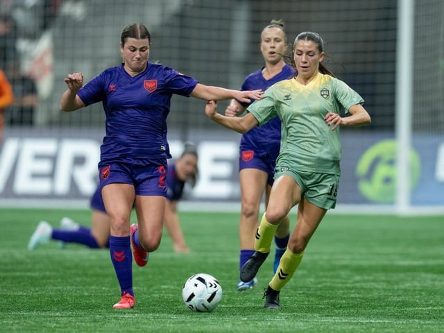  Calgary Wild FC’s Grace Stordy, left, and Vancouver Rise’s Holly Ward, right, vie for the ball during the first half of an NSL match in Vancouver on Wednesday, April 16, 2025.