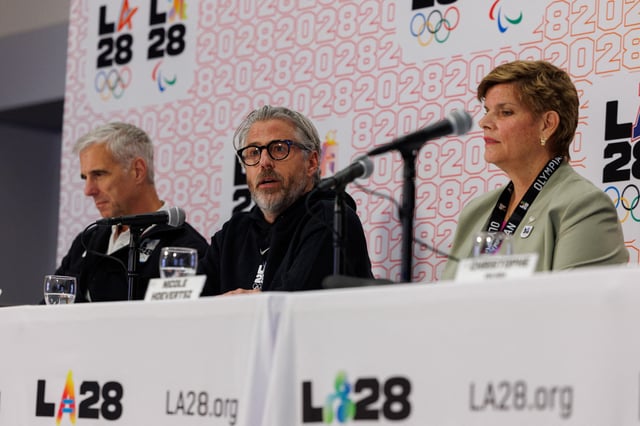 Casey Wasserman, LA28 Chairperson and President speaks between Nicole Hoevertsz, IOC Vice President and LA28 Coordination Commission Chair, and Reynold Hoover, LA28 Chief Executive Officer, during a press conference in Los Angeles, California, U.S. June 5, 2025.  REUTERS/Mike Blake