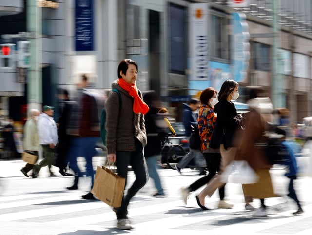 Shoppers make their way at a shopping district in Tokyo, Japan, March 19, 2024. REUTERS/Kim Kyung-Hoon/File Photo