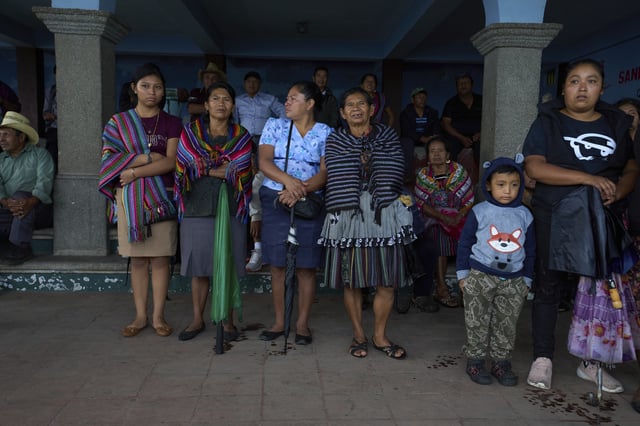 Families evacuated from the area surrounding the Fuego Volcano stand in a temporary shelter in San Juan Alotenango, Guatemala, Thursday, June 5, 2025, after the volcano's explosive activity increased. (AP Photo/Moises Castillo)