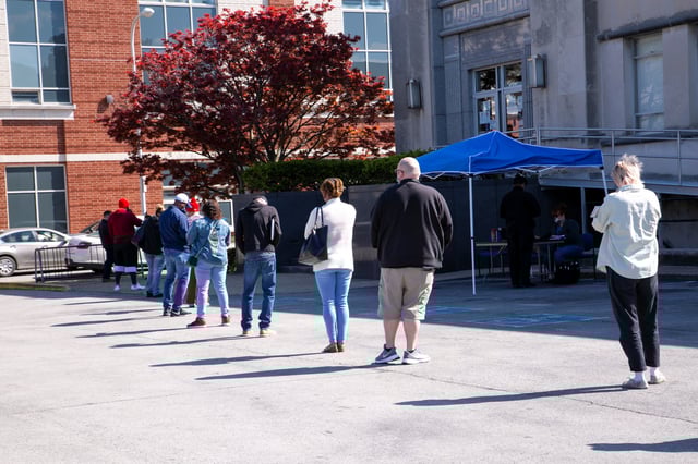 People wait in a line outside a newly reopened career center for in-person appointments in Louisville, Kentucky, U.S., April 15, 2021.  REUTERS/Amira Karaoud/ File Photo