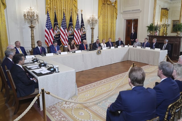 President Donald Trump, seated and center, listens during a Make America Healthy Again (MAHA) Commission Event in the East Room of the White House, Thursday, May 22, 2025, in Washington. (AP Photo/Jacquelyn Martin)