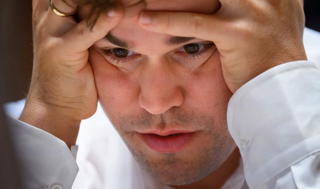07 February 2025, Schleswig-Holstein, Wangels: Magnus Carlsen, world number one in the World Chess Federation rankings, looks at the chessboard during the Freestyle Chess Grand Slam at the Weissenhaus Private Nature Luxury Resort in Wangels. Photo: Gregor Fischer/dpa (Photo by Gregor Fischer/picture alliance via Getty Images)